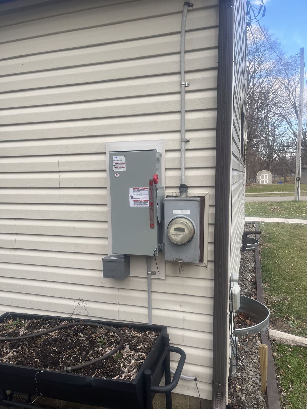 Generator transfer switch and meter on siding